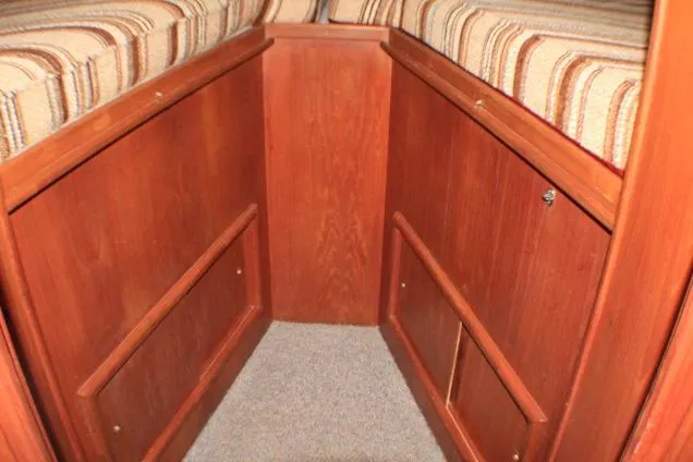 Slide: The Image of 1986 Lynnwood Flybridge Sedan interior with wood paneling and striped upholstery. - 88