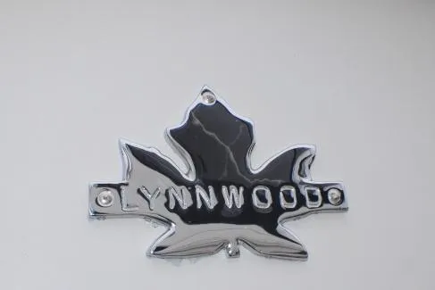 Slide: The Image of Chrome Lynnwood emblem on 1986 Flybridge Sedan boat. - 9