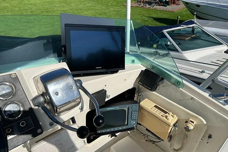 Slide: The Image of 1973 Bertram 28 Flybridge Cruiser helm with navigation equipment and controls. - 7