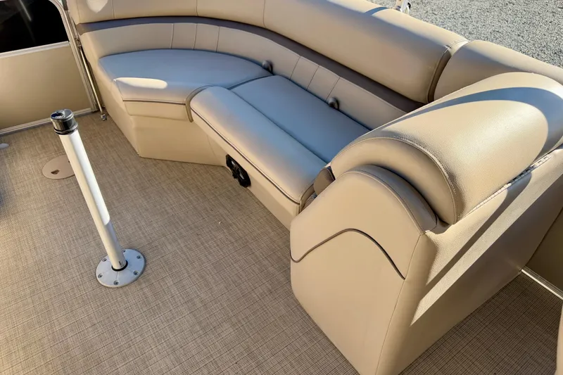 Slide: The Image of Luxurious seating on a 2020 Berkshire 25SL pontoon boat with beige upholstery. - 16