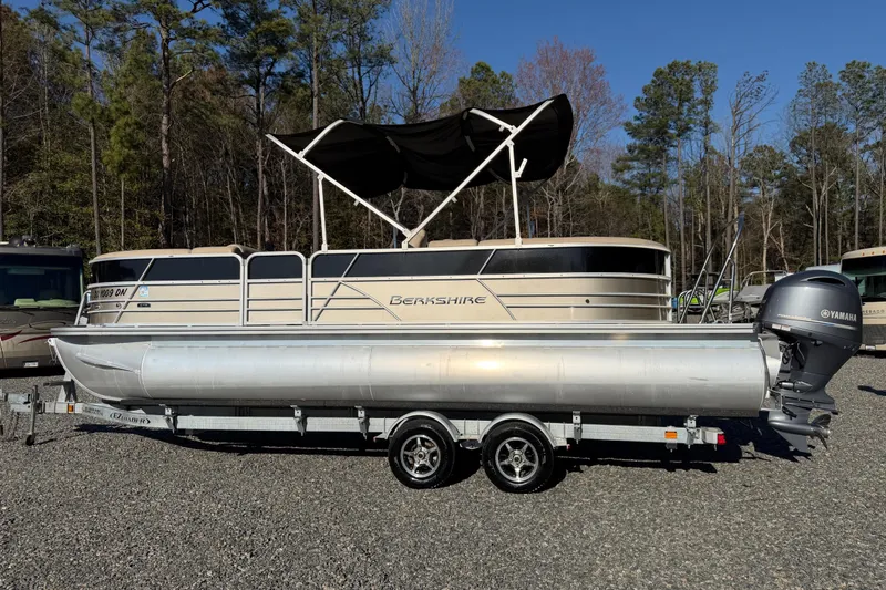 Slide: The Image of 2020 Berkshire 25SL pontoon boat with Yamaha outboard motor on a trailer. - 22
