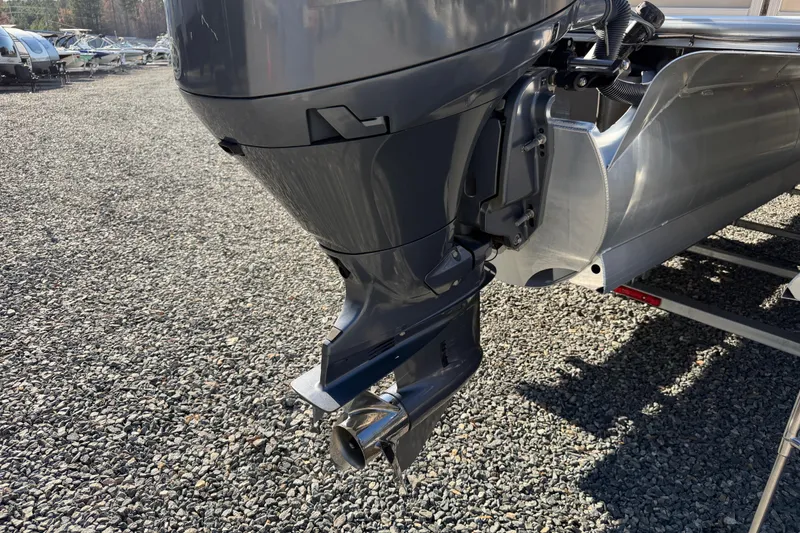 Slide: The Image of 2020 Berkshire 25SL boat motor and hull on gravel surface. - 5