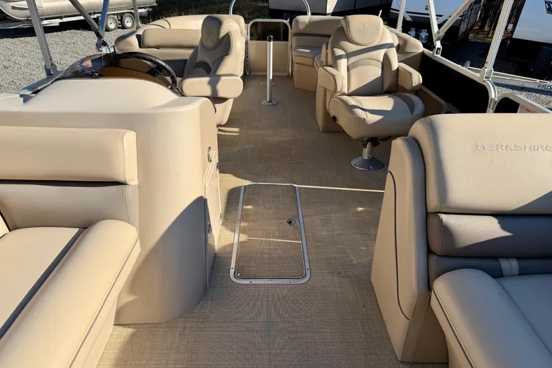 Slide: The Image of Luxurious interior of a 2020 Berkshire 25SL pontoon boat with beige seating. - 8