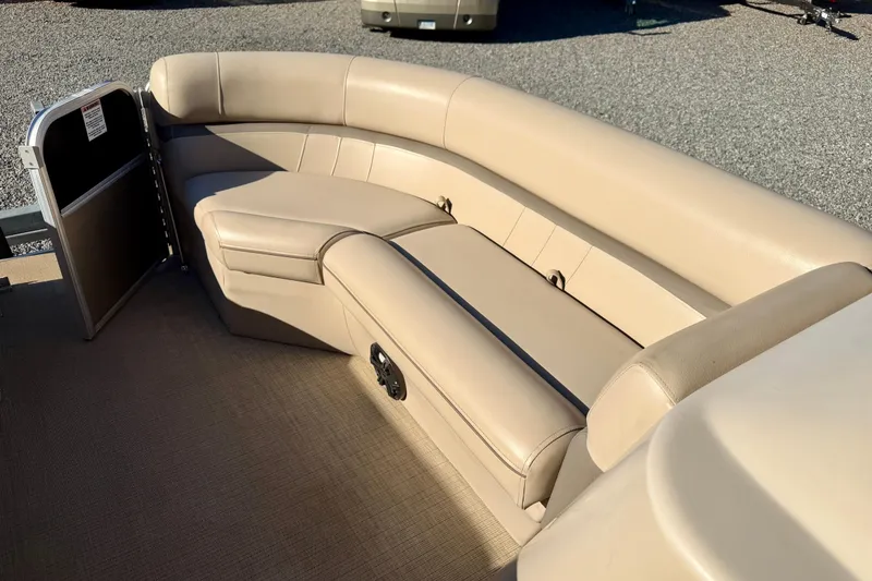 Slide: The Image of Luxurious beige seating on a 2020 Berkshire 25SL pontoon boat. - 9