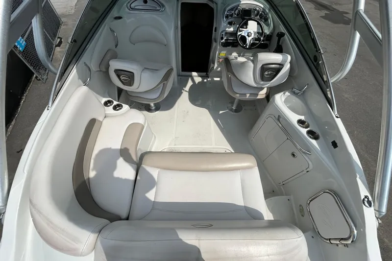 Slide: The Image of 2012 Crownline 236 SC boat interior with seating and steering wheel. - 14