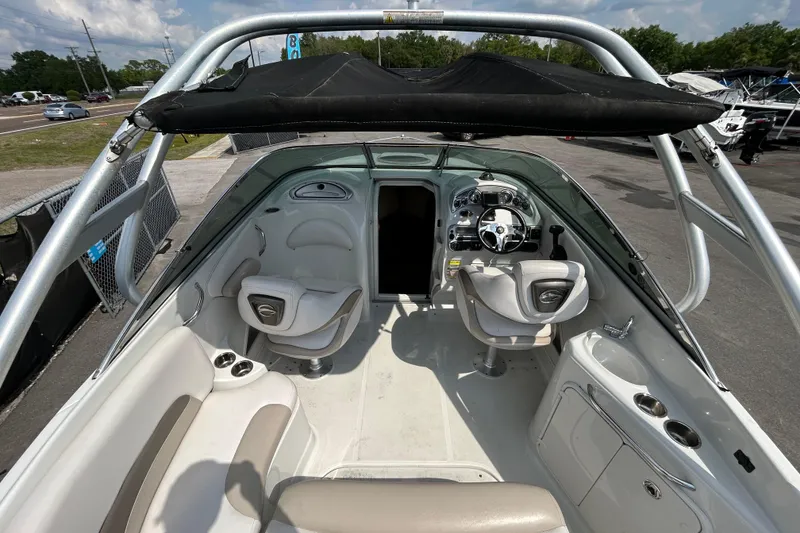 Slide: The Image of Interior view of a 2012 Crownline 236 SC boat with seating and steering console. - 15