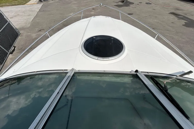 Slide: The Image of 2012 Crownline 236 SC boat deck with circular hatch and railing. - 19