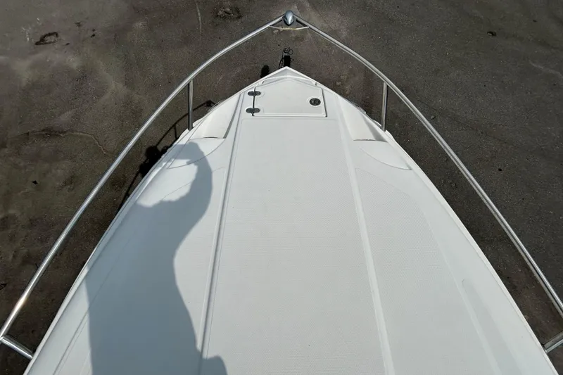 Slide: The Image of Bow view of 2012 Crownline 236 SC boat on sandy shore. - 20