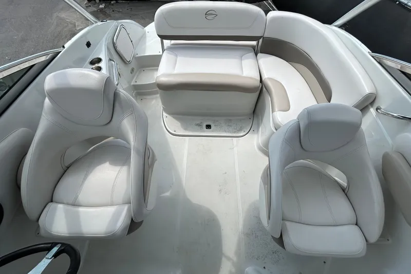Slide: The Image of Interior of a 2012 Crownline 236 SC boat with white seating arrangement. - 28