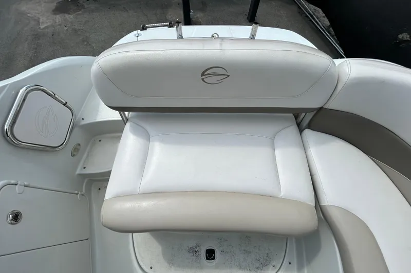 Slide: The Image of 2012 Crownline 236 SC boat interior with white seating and logo detail. - 30