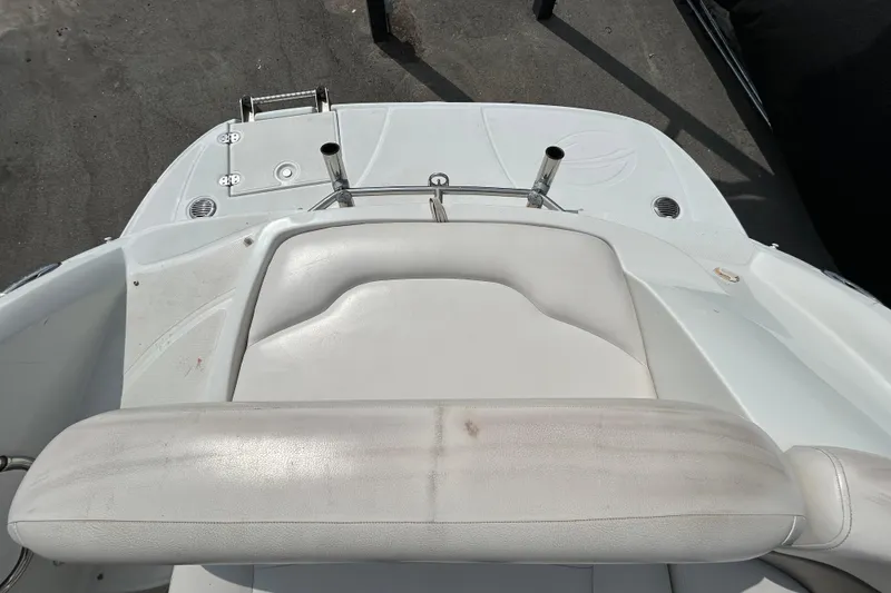 Slide: The Image of 2012 Crownline 236 SC boat interior with white seating and deck details. - 31