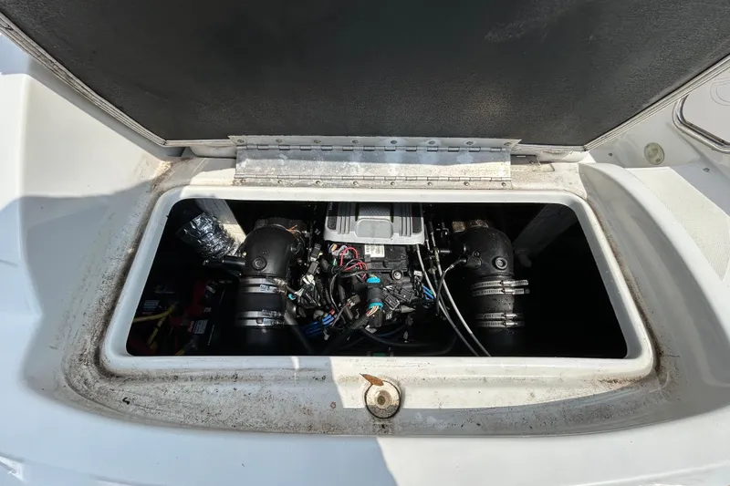 Slide: The Image of Engine compartment of a 2012 Crownline 236 SC boat, showcasing internal components. - 35
