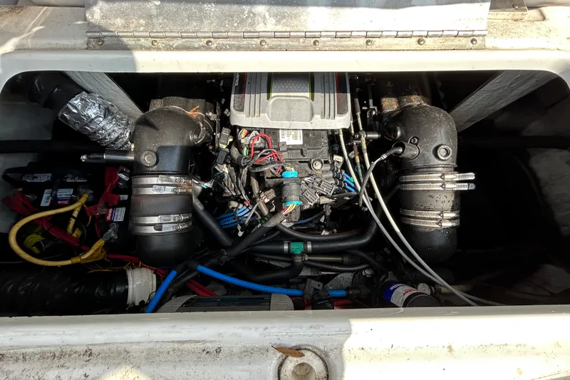 Slide: The Image of Engine compartment of a 2012 Crownline 236 SC boat, showing detailed mechanical components. - 36