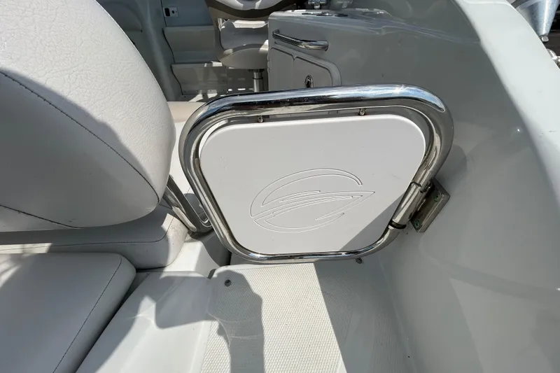 Slide: The Image of Interior of 2012 Crownline 236 SC boat with sleek seating and chrome accents. - 40