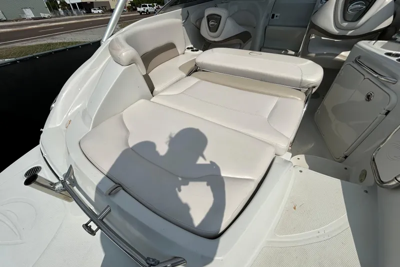Slide: The Image of 2012 Crownline 236 SC boat interior with white seating and shadow. - 42