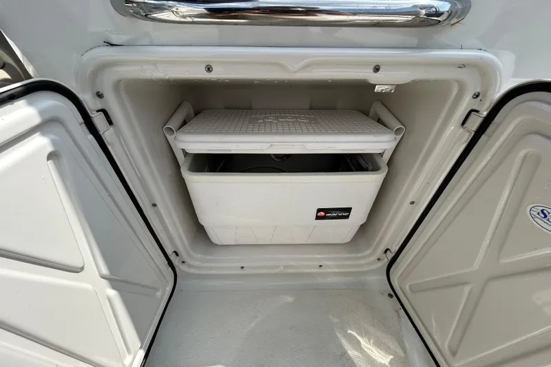 Slide: The Image of Storage compartment with cooler in 2012 Crownline 236 SC boat. - 45