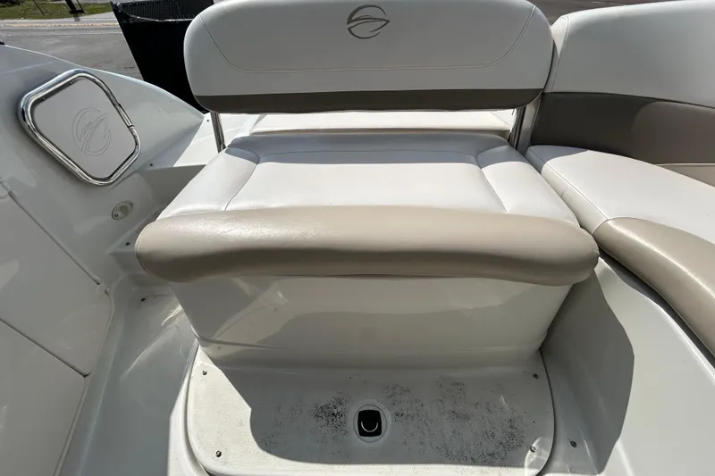 Slide: The Image of Crownline 236 SC 2012 boat seating area with beige and white upholstery. - 47