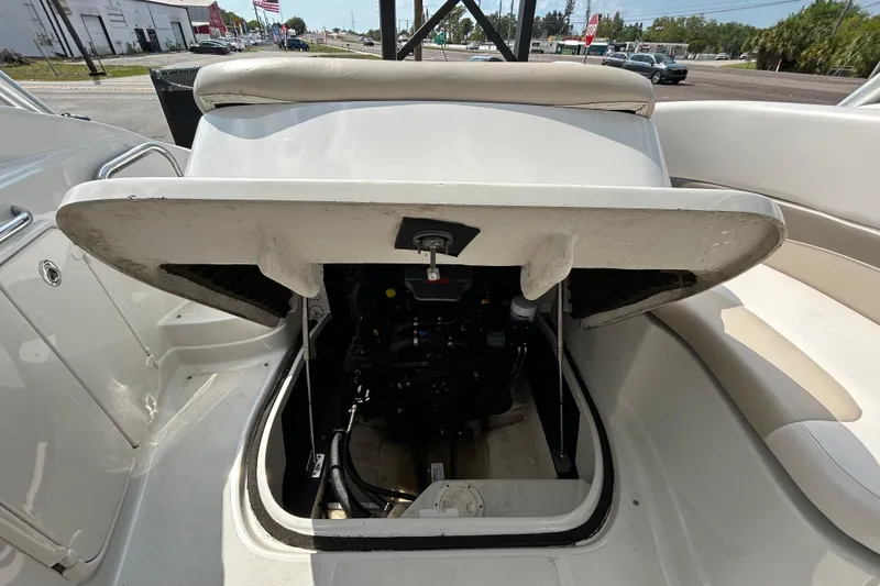Slide: The Image of 2012 Crownline 236 SC boat engine compartment open, showcasing interior mechanics. - 48