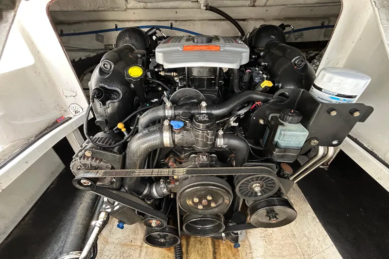 Slide: The Image of Engine of 2012 Crownline 236 SC boat, showcasing detailed components and layout. - 49