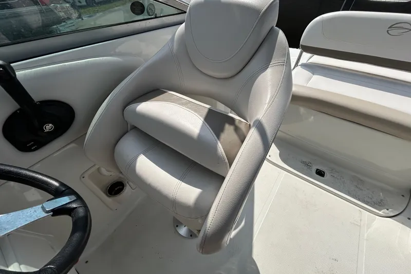 Slide: The Image of Interior seating of a 2012 Crownline 236 SC boat, featuring plush, ergonomic design. - 54