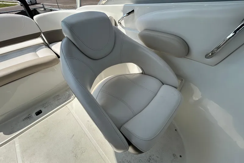 Slide: The Image of 2012 Crownline 236 SC boat interior with white cushioned seating. - 59