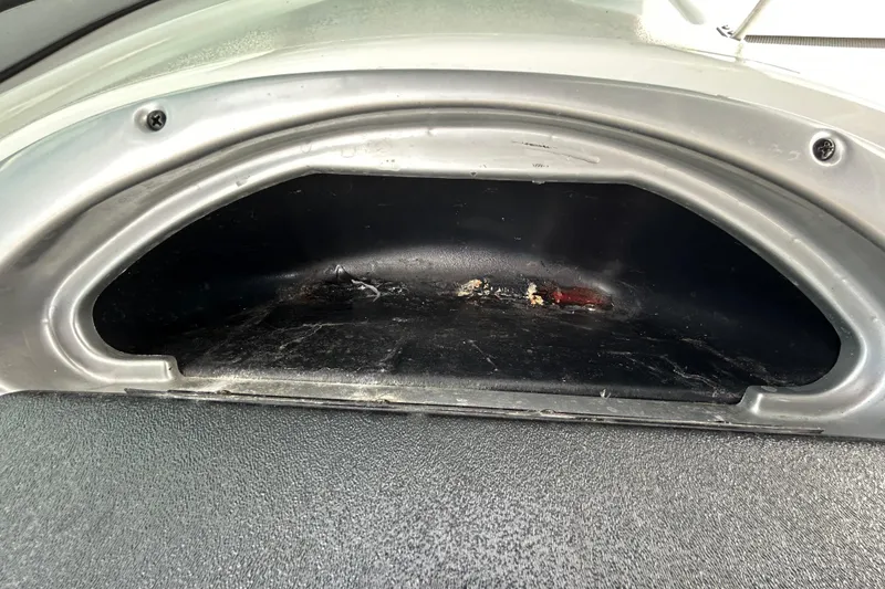 Slide: The Image of Storage compartment in a 2012 Crownline 236 SC boat, showing interior details. - 63