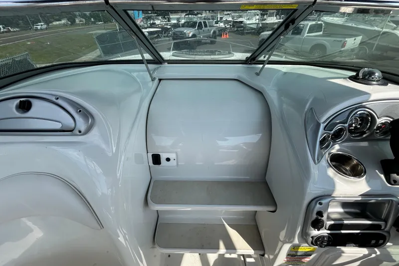Slide: The Image of Interior view of 2012 Crownline 236 SC boat dashboard and controls. - 67
