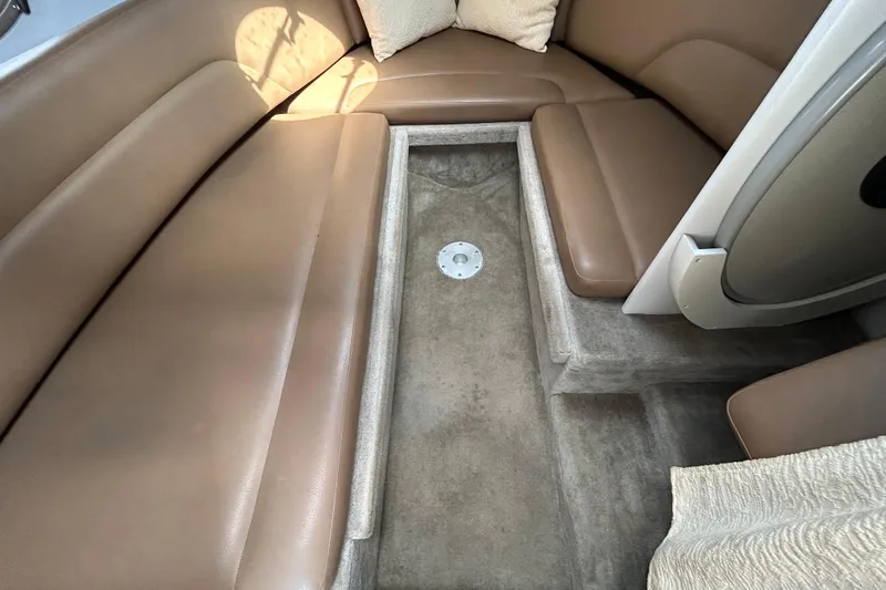 Slide: The Image of Interior of 2012 Crownline 236 SC boat with brown seating and carpeted flooring. - 69