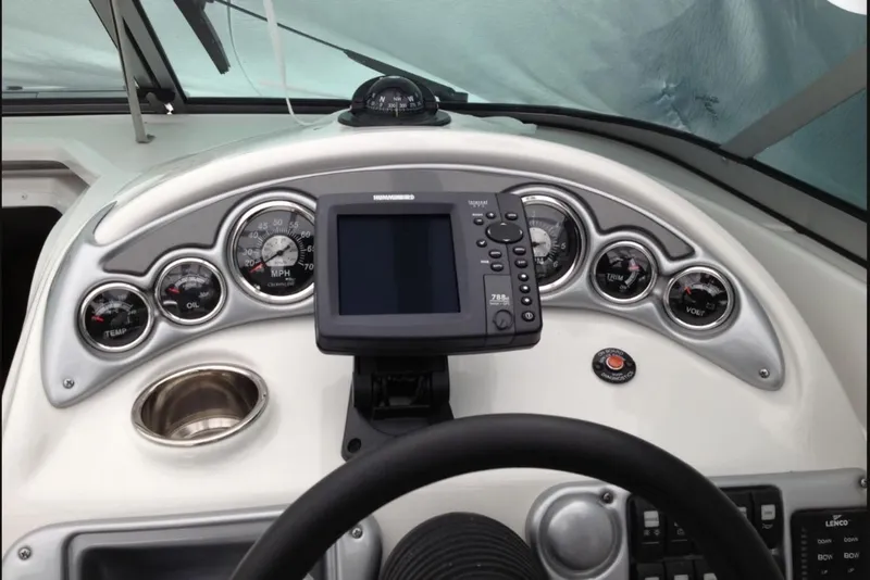 Slide: The Image of Dashboard of 2012 Crownline 236 SC boat with gauges and navigation system. - 7
