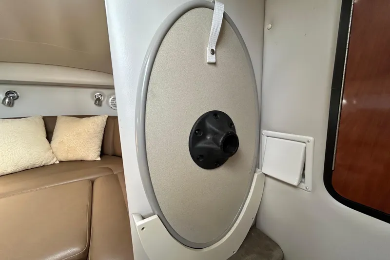 Slide: The Image of Interior of 2012 Crownline 236 SC boat with seating and storage compartment. - 80