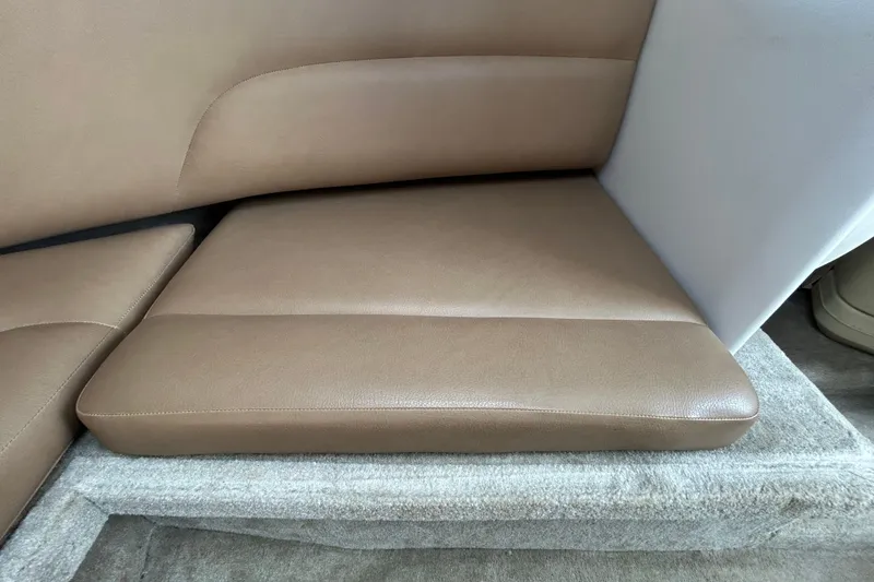 Slide: The Image of Brown leather seating in a 2012 Crownline 236 SC boat interior. - 81