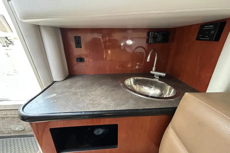Slide: The Image of 2012 Crownline 236 SC boat interior with sink and countertop. - 88
