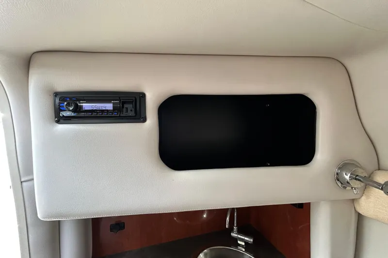 Slide: The Image of Interior of 2012 Crownline 236 SC boat with stereo system and sink. - 89