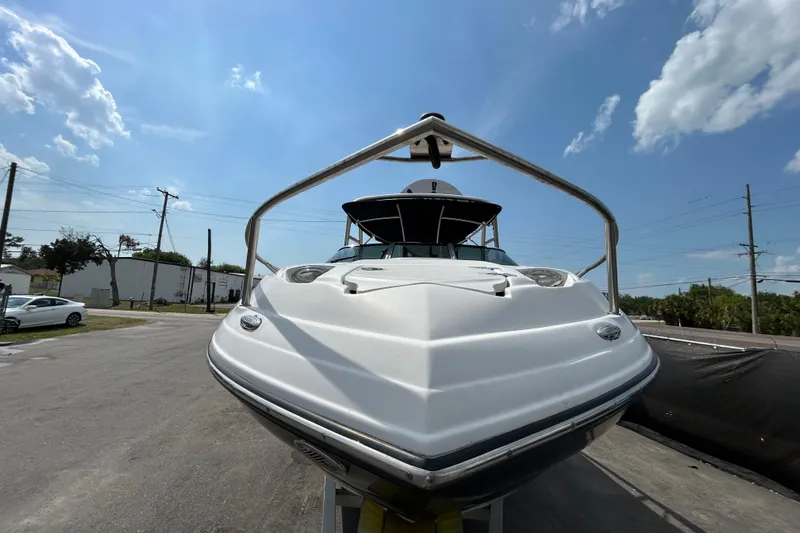 Slide: The Image of 2012 Crownline 236 SC boat on trailer under clear blue sky. - 9