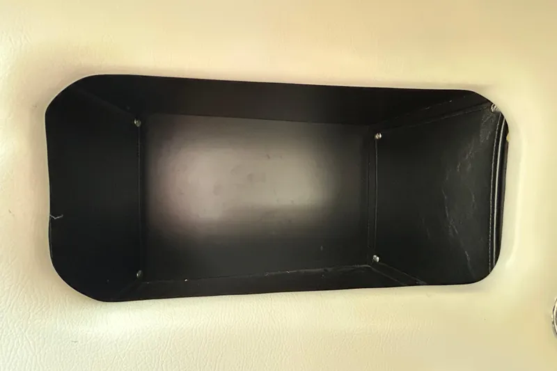 Slide: The Image of Storage compartment in a 2012 Crownline 236 SC boat interior. - 90