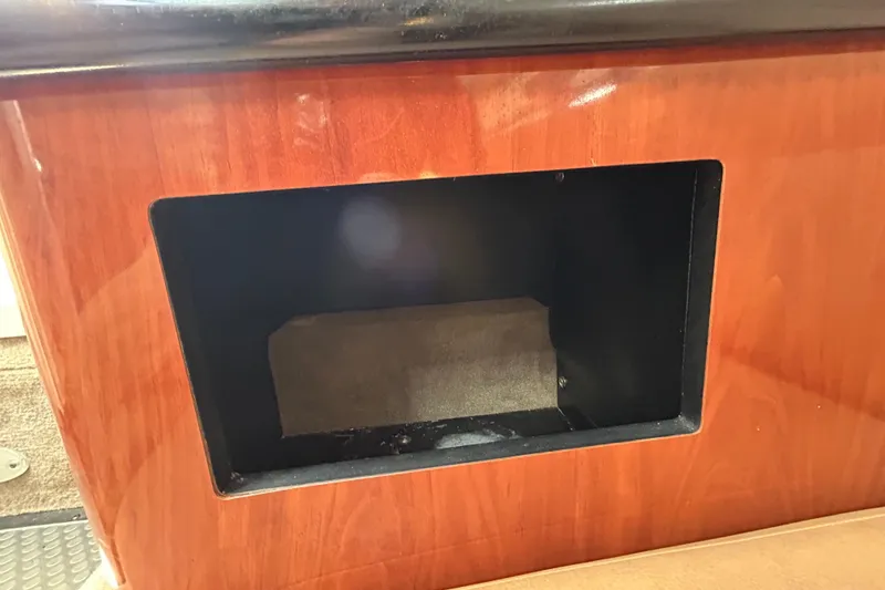 Slide: The Image of Wooden compartment interior of 2012 Crownline 236 SC boat. - 93