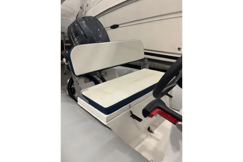 Slide: The Image of 2025 AB Inflatables Mares 12 VSX boat interior with seating and steering wheel. - 11