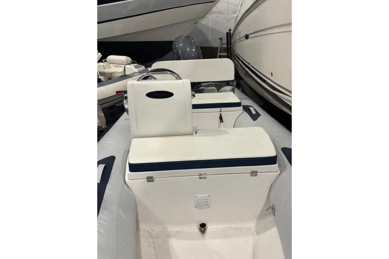 Slide: The Image of 2025 AB Inflatables Mares 12 VSX boat interior with seating and steering console. - 15