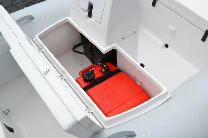 Slide: The Image of Manufacturer Provided Image: AB Inflatables Mares 12 VSX 2025 with open storage compartment and red canister. - 5