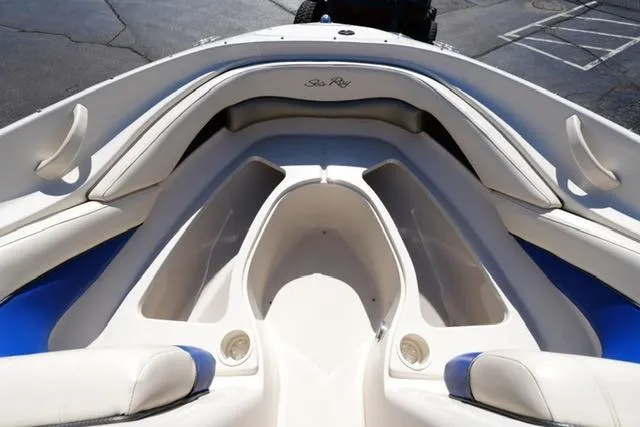 Slide: The Image of 2004 Sea Ray 200 Select boat interior with white and blue seating. - 11