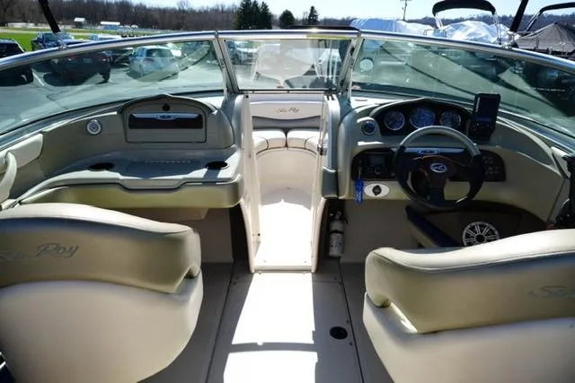 Slide: The Image of 2004 Sea Ray 200 Select boat interior with steering wheel and dashboard controls. - 14