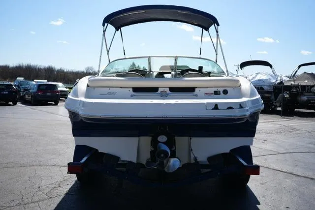 Slide: The Image of Rear view of a 2004 Sea Ray 200 Select boat with canopy in a parking lot. - 6