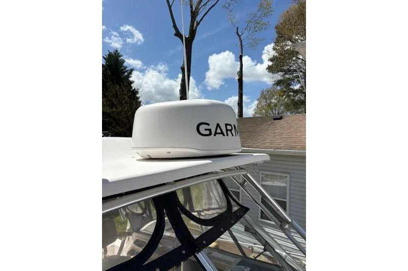 Slide: The Image of 2003 Grady-White Marlin 300 boat with Garmin radar, clear sky background. - 17