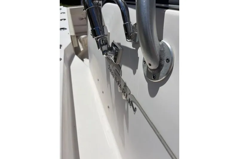 Slide: The Image of Close-up of a 2003 Grady-White Marlin 300 boat's chrome fittings and branding. - 18