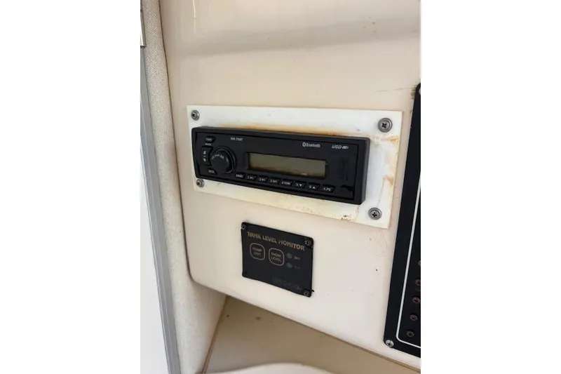 Slide: The Image of 2003 Grady-White Marlin 300 boat stereo system and trim level monitor. - 28