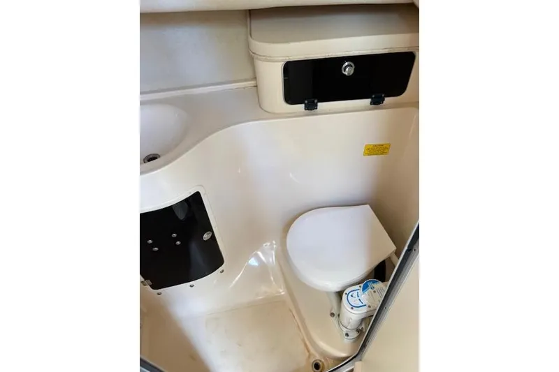 Slide: The Image of 2003 Grady-White Marlin 300 boat bathroom interior with toilet and sink. - 29