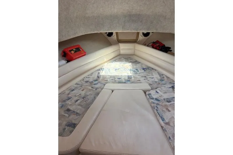 Slide: The Image of Interior cabin of 2003 Grady-White Marlin 300 boat with cushioned seating. - 31