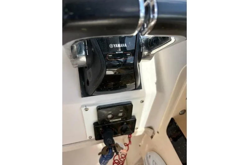 Slide: The Image of Yamaha control panel on 2003 Grady-White Marlin 300 boat dashboard. - 37
