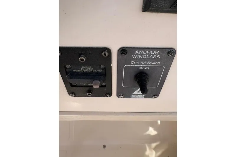 Slide: The Image of Control panel of a 2003 Grady-White Marlin 300 boat with anchor windlass switch. - 39