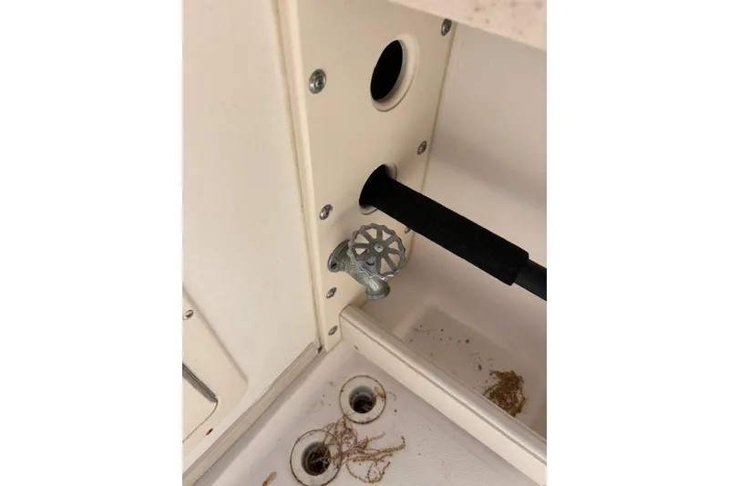 Slide: The Image of 2003 Grady-White Marlin 300 boat interior showing a valve and drainage system. - 40